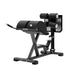 Angled side view of the jordan glute and hamstring machine in grey