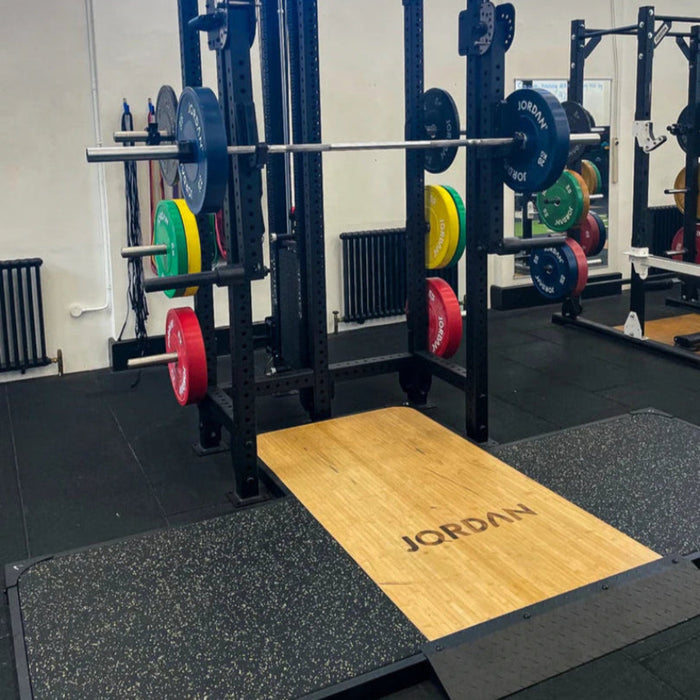 JORDAN J75 Weight Lifting Platform shown installed at a gym next to a gym rack